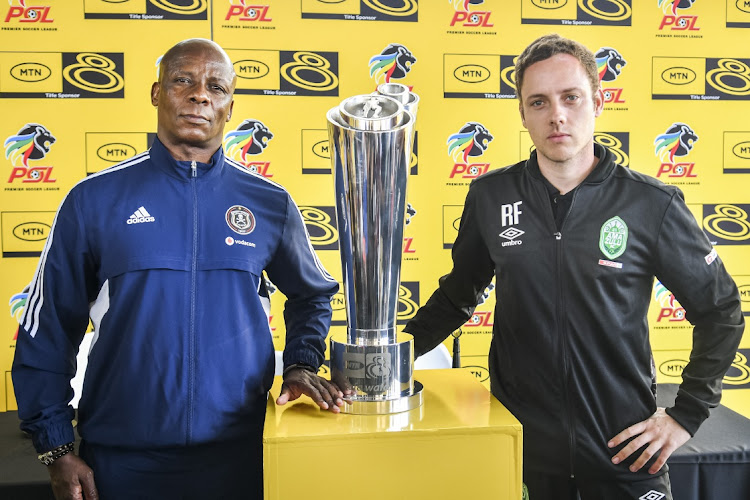 Orlando Pirates assistant coach Mandla Ncikazi and AmaZulu FC coach Romain Folz with the trophy during a joint press conference in Durban.