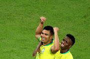 Brazil's Casemiro celebrates scoring their first goal with Vinicius Junior REUTERS/Marko Djurica