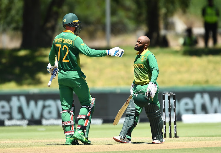 SA captain Temba Bavuma celebrates scoring a century in the first ODI against India at Boland Park on Wednesday. With him is Rassie van der Dussen who also scored a ton.