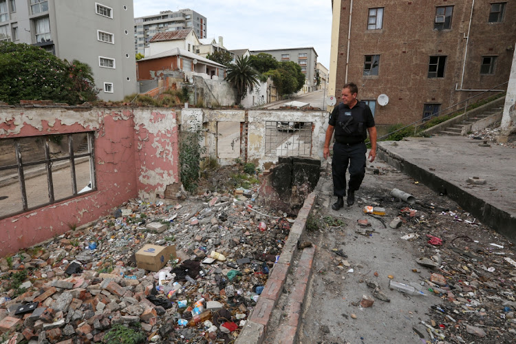 Citywide Security personnel recently visited several illegally occupied buildings in Central, Gqeberha, to notify the occupants that the premises would be bricked up. Paul Smook inspects an illegally occupied building in Hope Street