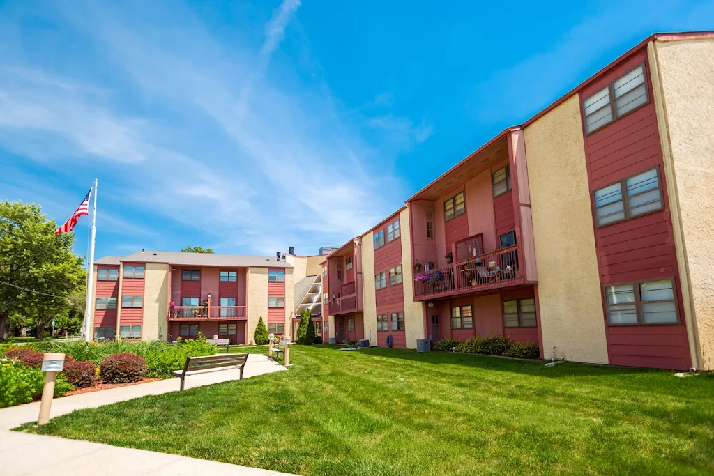 Oak Manor building with outdoor benches, landscaping