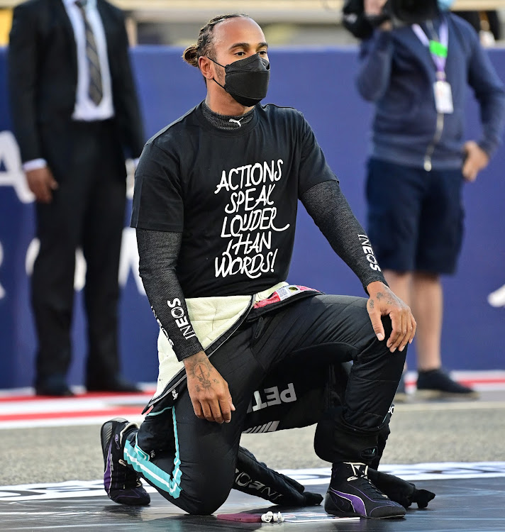 Lewis Hamilton kneels in support of the Black Lives Matter campaign before the 2021 Bahrain GP.