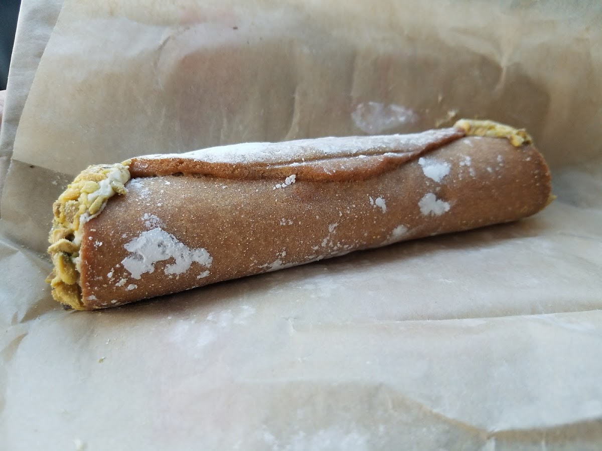 GF pistachio cannoli. It was very good. I didn't ask but I think the shell may be baked, not fried. I was surprised how much I liked it.