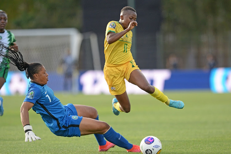 Banyana Banyana's Thembi Kgatlana is fouled by Nigerian goalkeeper Oluehi Tochukwu in the Women's Africa Cup of Nations group game at Stade Prince Moulay Al Hassan Stadium in Rabat, Morocco on July 4 2022.