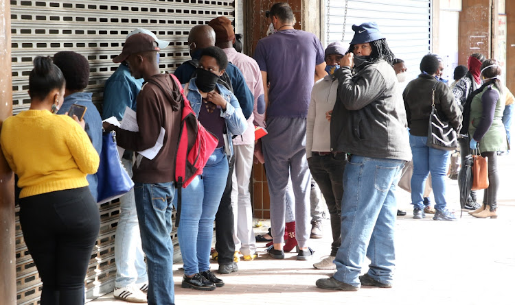 People queue up at the department of labour offices in Govan Mbeki Avenue on Monday