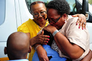 October 21 2019: AfroCentric Chairman Dr Anna Mokgokong comforting School principal Lydia Phephi could not hide her tears as she said this was a big relief for her pupils.  