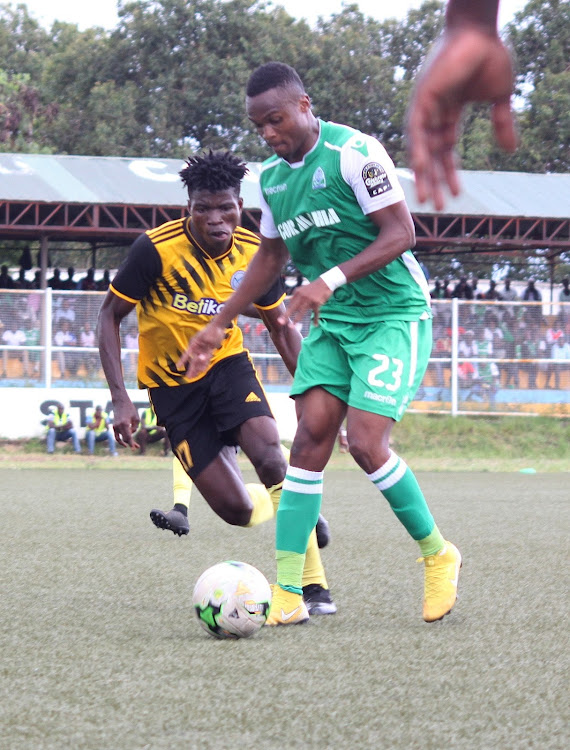 Gor Mahiaa's Cliffton Miheso shields the ball from Sofapaka's Jedinak Ameyaw during yesterday's match at Moi Stadium in Kisumu.