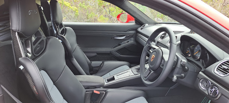 Racy bucket seats and a steering wheel without distracting buttons. Picture: DENIS DROPPA