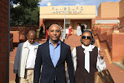 Romeo and Basetsana Khumalo leaving the Randburg magistrates court with friends and family members who come to support them on a defamation case they have against Jackie Phamotse.