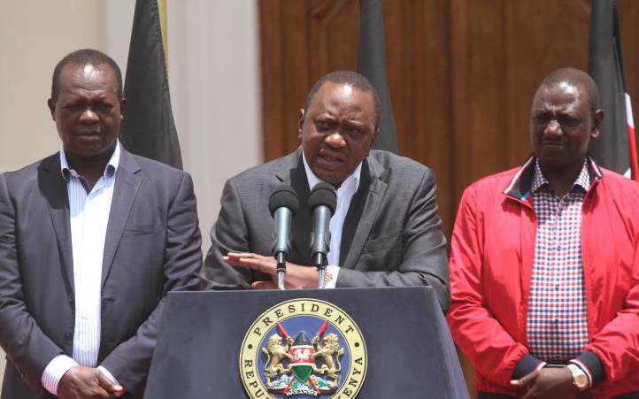 Jubilee secretary general Raphael Tuju, President Uhuru Kenyatta and Deputy President William Ruto at a past media briefing.