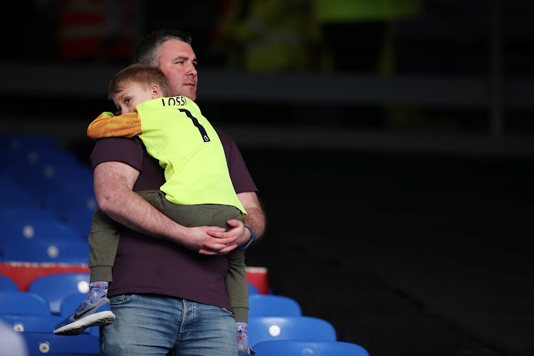 Huddersfield Town fans react after their team was relegated from the Premier League