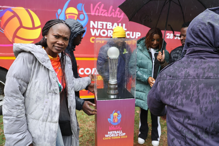 Manzo Machoga, former Proteas player, poses with the trophy during the Netball World Cup trophy stop in Braamfontein, Johannesburg.