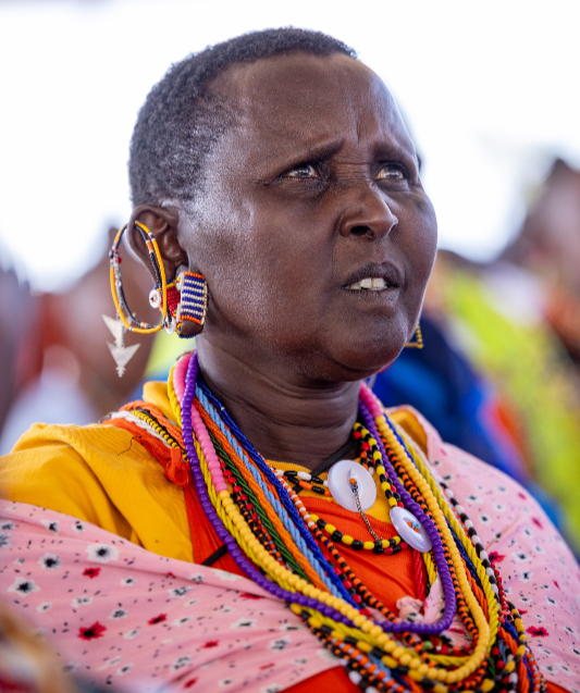 A woman follows proceedings during the interdenominational thanks giving service for Tourism PS John Ololtua held in Ildolisho Village in Kilgoris, Narok County on March 17, 2024