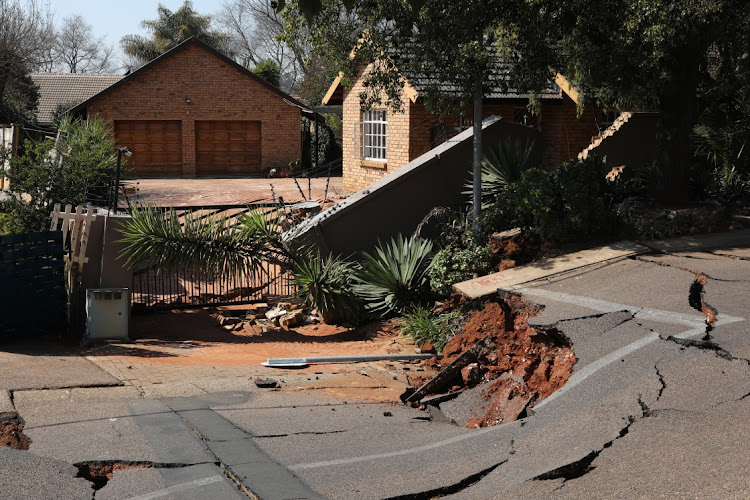 Residents in Burger Street in Lyttelton, Centurion, had parts of their property swallowed by a 4m sinkhole which developed overnight on Sunday. Picture Thapelo Morebudi