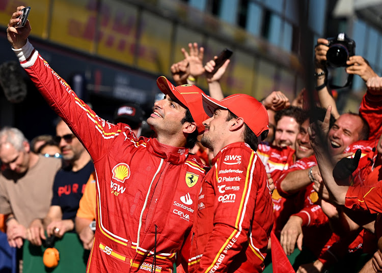 Ferrari's Carlos Sainz Jr. (left) and Charles Leclerc celebrate after finishing first and second in the Australian Grand Prix. Picture: REUTERS