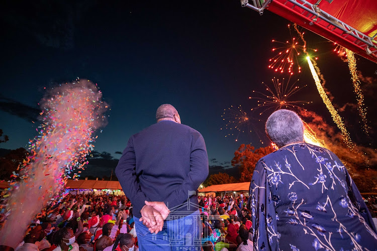 President Uhuru and Margaret Kenyatta observe sparks in the air