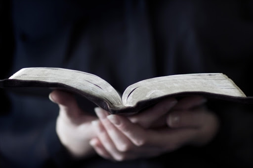 Man reading a bible