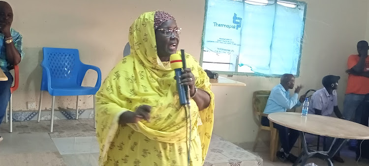 Tana River Woman Representative Rehema Hassan addressing non-locals residing in Madogo during a meeting held at a Madogo hotel on Thursday, May 12.