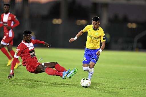 Godfred Asante of Horoya and Gaston Sirino of Mamelodi Sundowns during the CAF Champions League match.