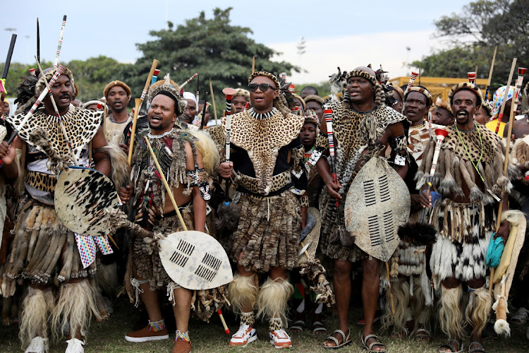 Minister of sport, arts and culture Zizi Kodwa flanked by amabutho as he arrives at Moses Mabhida People's Park for the second Ingoma Kazwelonke.