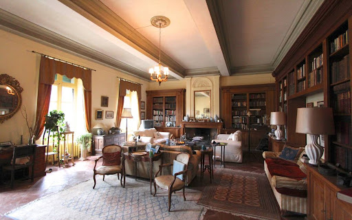 Living room with library and fireplace in this luxury castle for sale in Carcassonne ($1,273,954 - 840 m²)