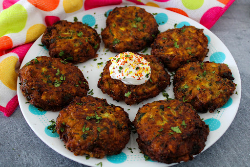 Country Garden Fritters With Chili Lemon Cream on a plate.