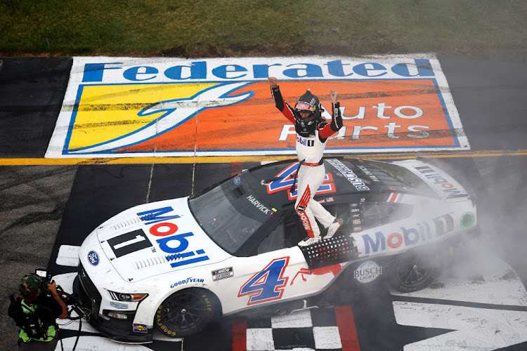 Kevin Harvick celebrates after winning the NASCAR Cup Series Federated Auto Parts 400 at Richmond Raceway on August 14 2022 in Richmond, Virginia.