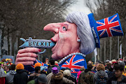 A float featuring British Premier Theresa May drives in the annual Rose Monday parade on February 27, 2017 in Dusseldorf, Germany. Political satire is a traditional cornerstone of the annual parades and the ascension of Trump to the US presidency, the rise of the populist far-right across Europe and the upcoming national elections in Germany provided rich fodder for float designers this year. 