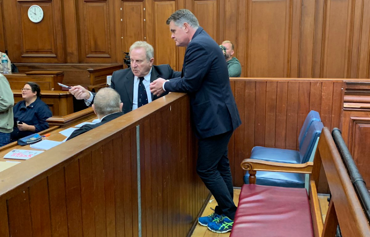 Jason Rohde talks to his attorney, Tony Mostert, in the high court in Cape Town on Wednesday December 5, 2018.