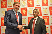 New Golden Lions president Neville Jardine (R) is congratulated by his predecessor Kevin de Klerk (L) on Monday September 17 2018. 