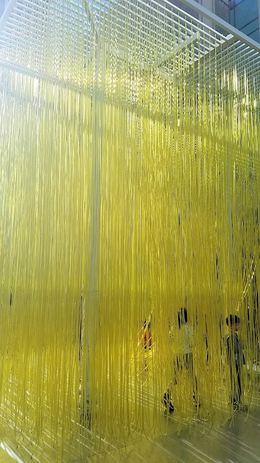 Jesús Rafael Soto's Penetrable, also known as Yellow Noodles or Spaghetti sometimes. It's a grid simply with yellow plastic hoses that viewers can interact with for free, on loan until Feb 2017 at LACMA in the main plaza