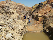 Johannesburg Water employees working on the 'biggest leak' in the city's history.