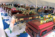 Coffins are lined up in two rows during the funeral service of 21 of the 24 victims of the collision between an overloaded minibus taxi and a bus June 16. The service was held in GaRapitsi Vilage in Kgapane at the weekend. 
