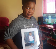 Antoinette Assegaai from Westdene holds a picture of her two-year-old daughter Tshepang, who died last month from suspected poisoning. 
