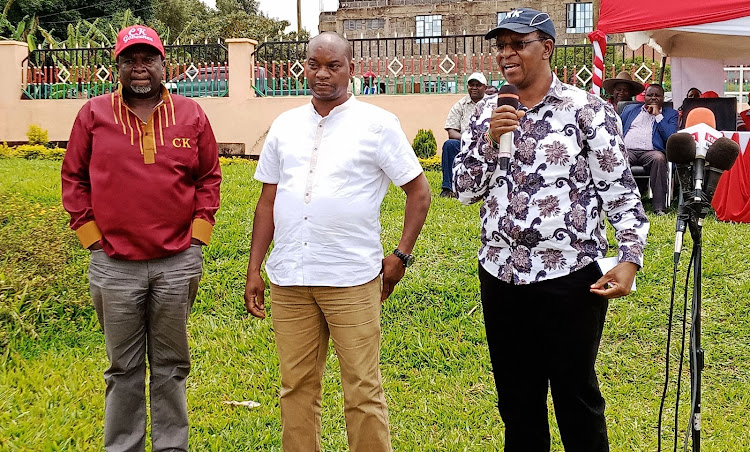 Interior PS Karanja Kibicho with Kirinyaga senator Charles Kibiru (left)and Kirinyaga deputy governor Peter Ndambiri during a jubilee party event earlier last month .