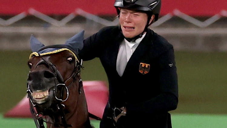 Annika Schleu of Germany reacts before being eliminated during the modern pentathlon in the Tokyo Olympics