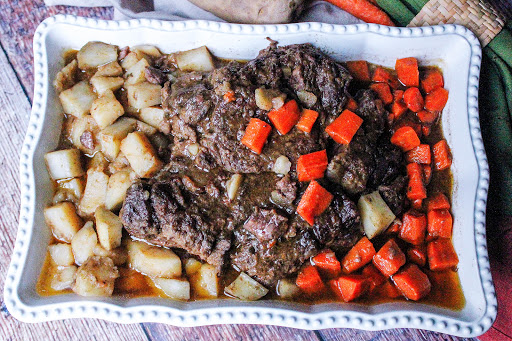 Pot Roast With Carrots & Potatoes on a serving tray.