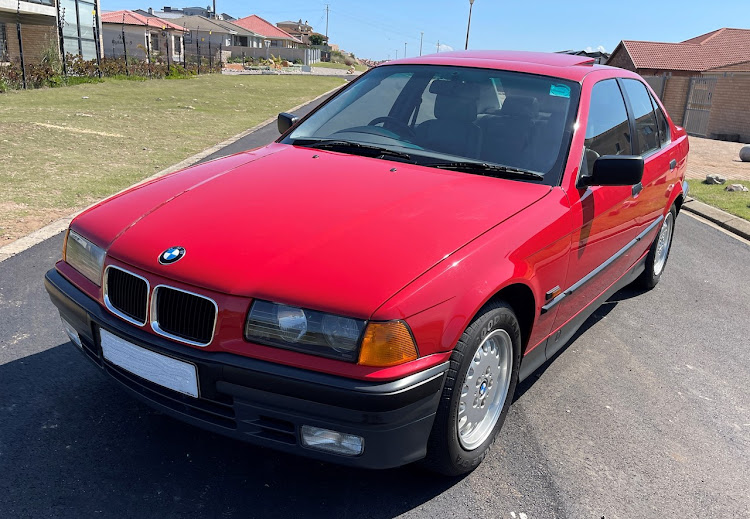 Amber indicator lenses and grey bumpers are typically 90s.