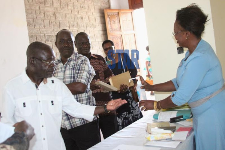 Ushers at ACK St Stephen Cathedral in Kisumu sprinkles hand sanitizer to faithfuls on March 15, 2020.