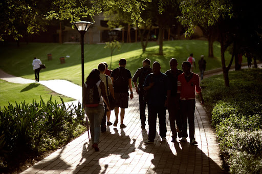 Students walking on campus.