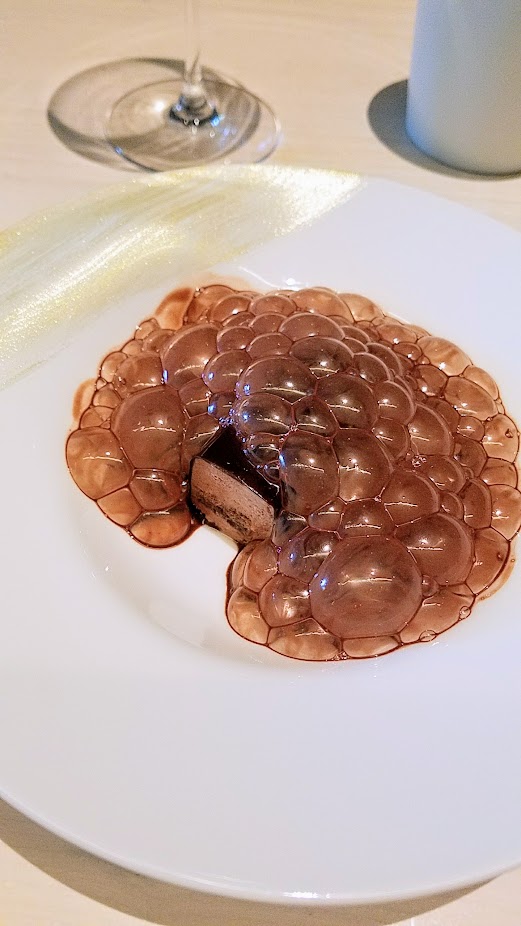 A Meal at In Situ, a restaurant at SF MOMA offering iconic dishes: this is Interpretation of Vanity, a dish of moist chocolate cake, cold almond cream, bubbles and cocoa curated from chef Andoni Luis Aduriz, Mugaritz from Errenteria, Spain, 2007