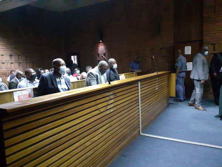 The three accused in the Pretoria magistrate's court on April 1 2021.
