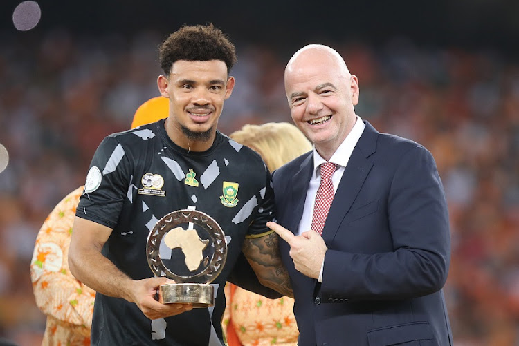 Fifa president Gianni Infantino hands over Goalkeeper of the Tournament award to Bafana Bafana captain Ronwen Williams after the Africa Cup of Nations final between Nigeria and Ivory Coast at Stade Alassane Ouattara in Abidjan, Ivory Coast on Sunday night.