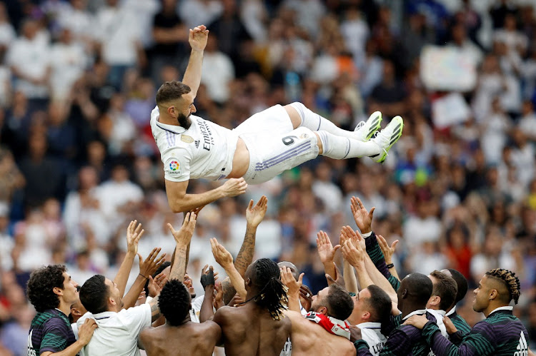 Real Madrid players throw Karim Benzema in the air after the La Liga match against Athletic Bilbao at Santiago Bernabeu, Madrid on June 4, 2023