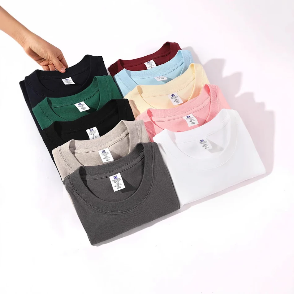 T-shirt femme ample à col rond, épaules tombantes, couleur unie, facile à assortir, idéal pour un look décontracté et confortable au quotidien.
