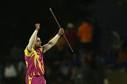 Tabraiz Shamsi of the Paarl Rocks celebrates with a magic trick after taking a wicket during a Mzansi Super League match. 