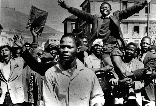 A young Philip Kgosana is carried shoulder-high by marchers in March 1960.