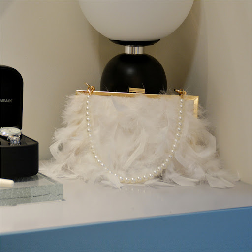 Title 7, Cross-slung hand bag with ostrich hair and pear...
