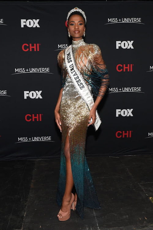 Miss Universe 2019 Zozibini Tunzi was crowned in an ombre 'Sunrise' dress by Biji La Maison.