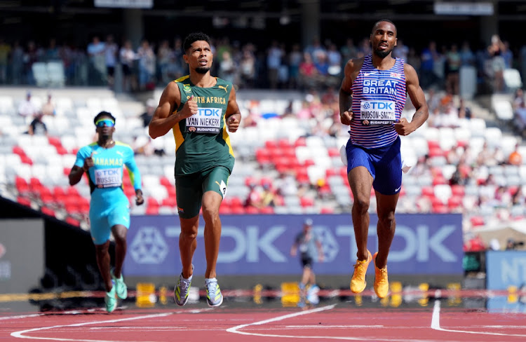 Wayde Van Niekerk wins his 400m heat ahead of Britain’s Matthew Hudson-Smith at the world championships in Budapest on Sunday. Picture: REUTERS/SARAH MEYSSONNIER